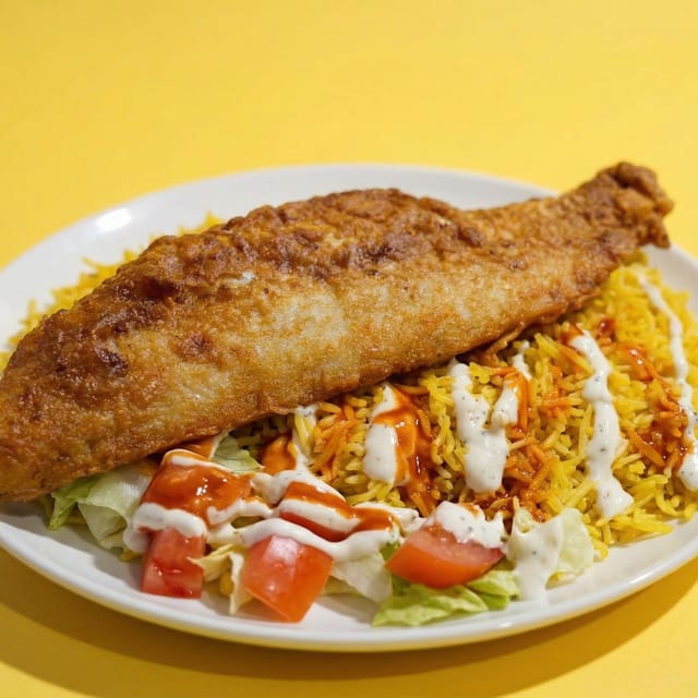 Fried Whiting Fish Over Rice.